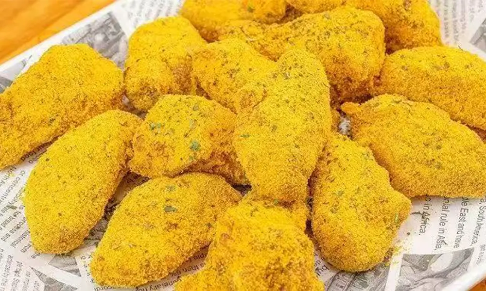 Crispy chicken wings coated in cheese powder at Fuji Ramen Japanese Cuisine, a Japanese Restaurant in New Philadelphia